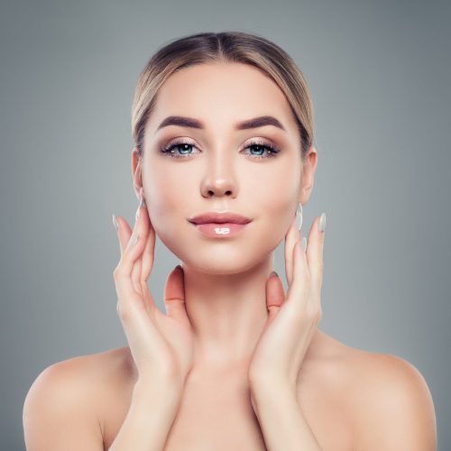 Beautiful young woman with healthy skin. Facial treatment, skincare and cosmetology concept