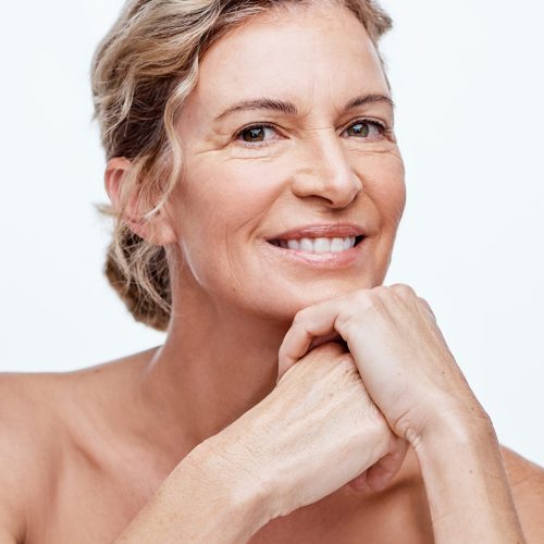 Shot of a beautiful mature woman posing against a white background.